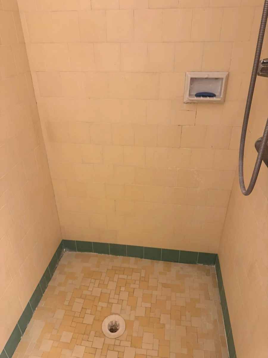 Stained grout before and after tile refinishing